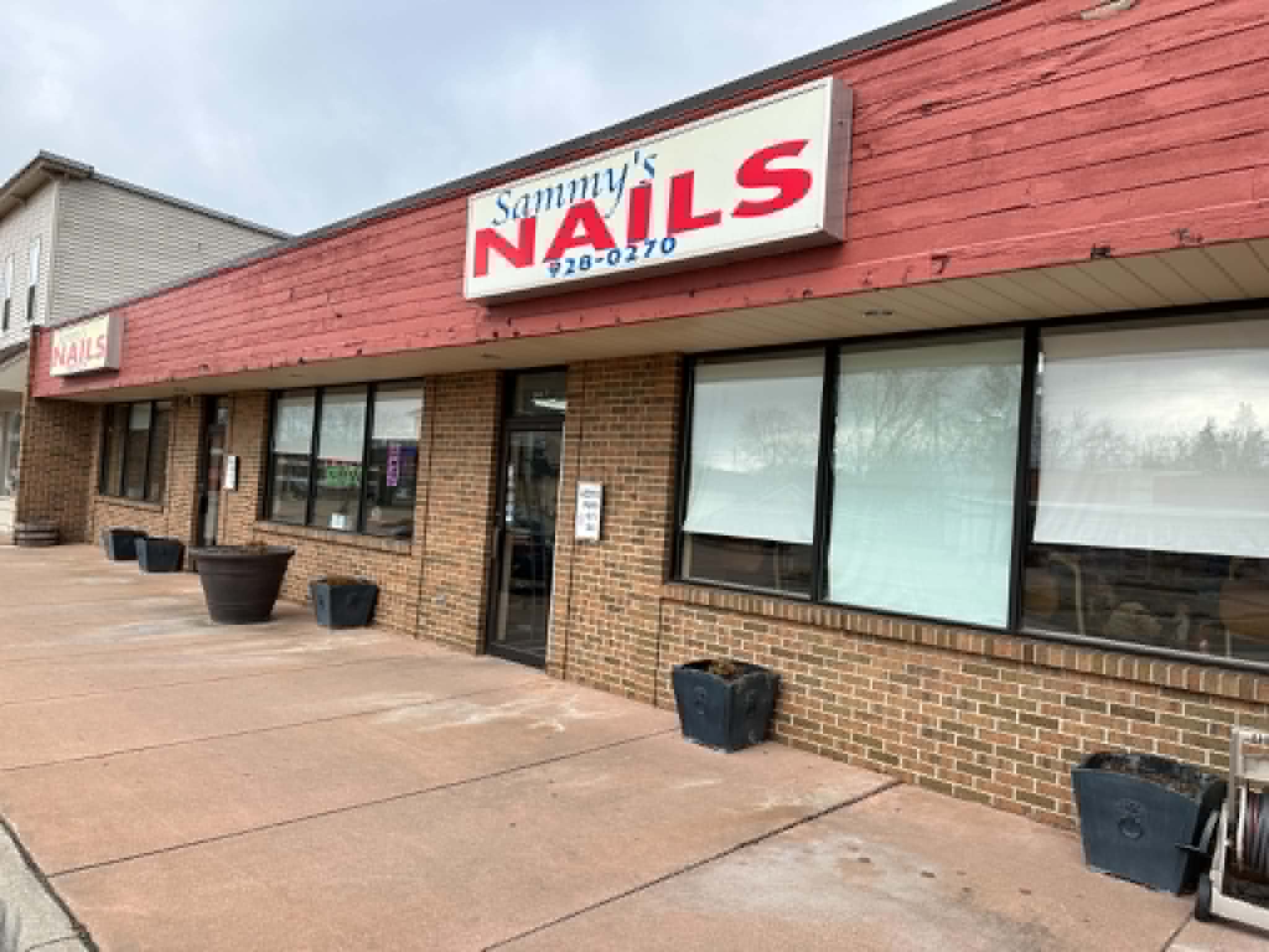 Sammy's Nails salon before Amori Agency — no signage, no online presence