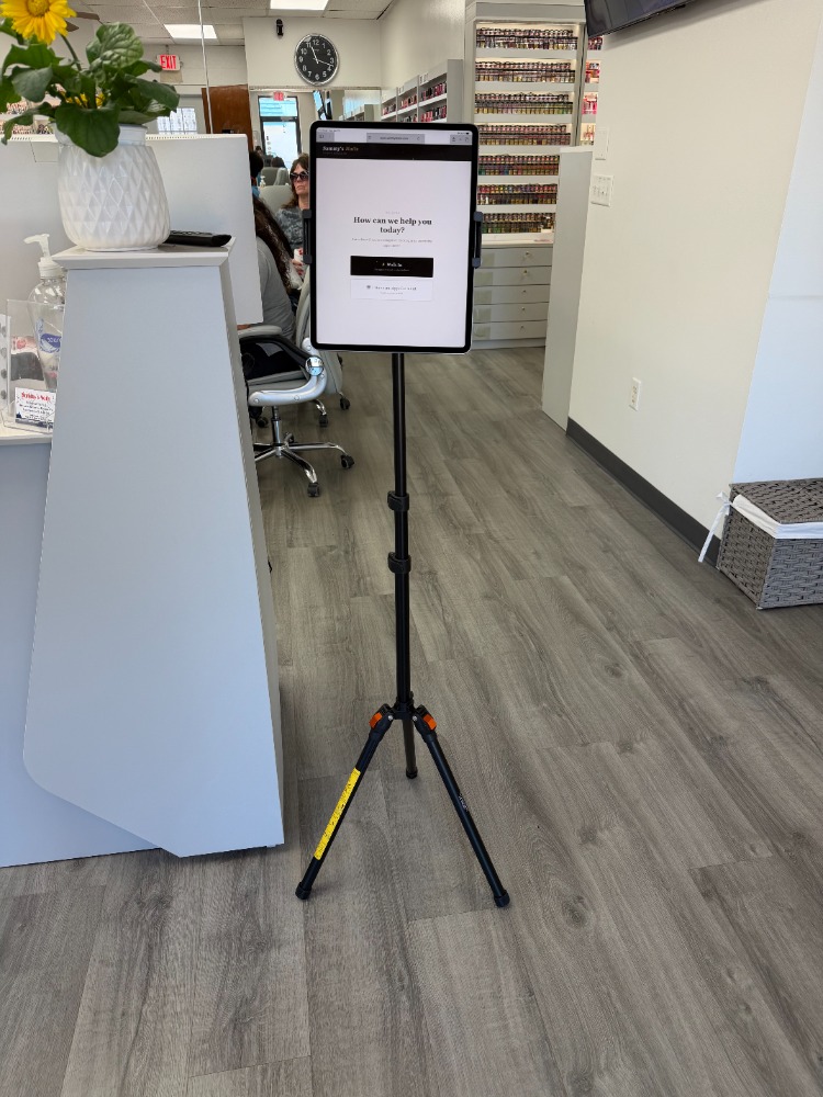 TurnBook kiosk live at a nail salon on iPad tripod stand